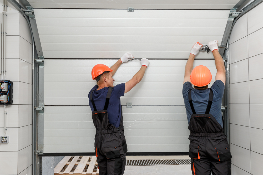 Workers are installing lift gates